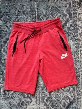 Nike Red Athletic Shorts with Black Zip Details